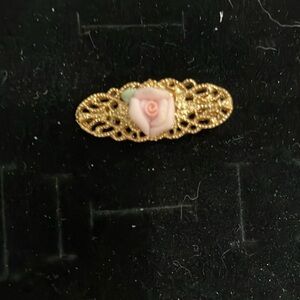 1928 brand gold tone Filigree Rose Brooch with pink porcelain rose.